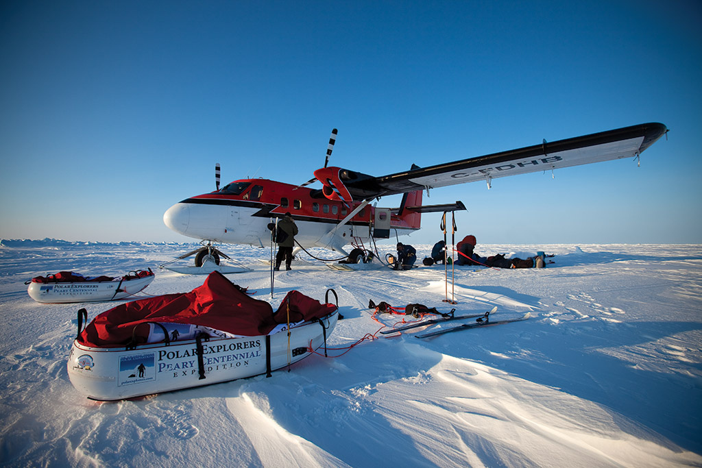 On March 25, 2009, the twin otter lands on the sea ice at 85 degrees latitude north in minus 42F degrees. Sebastian and Keith are off towing 200lbs each.